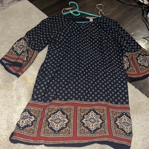 A dark blue dress with a beautiful design, long sleeve, never worn, forever 21